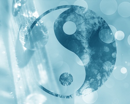 yin yang sign on a natural blue backgroundの写真素材