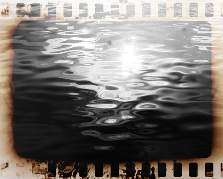 Old film strip on a grunge like backgroundの写真素材