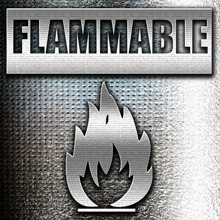 Grunge metal Flammable hazard sign with yellow and black colorsの写真素材