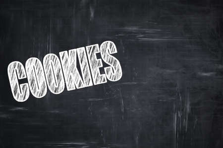 Chalkboard background with white letters: Chalkboard background with white letters: Delicious cookies sign with some soft smooth linesの写真素材