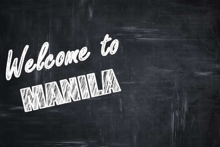 Chalkboard background with white letters: Chalkboard background with white letters: Welcome to manila with some smooth linesの写真素材