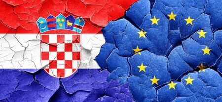 croatia flag with european union flag on a grunge cracked wall