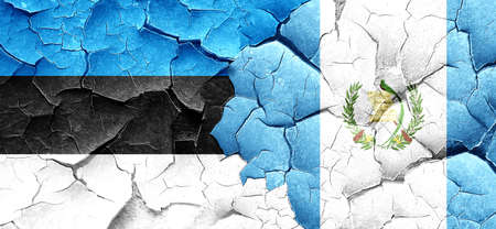 estonia flag with Guatemala flag on a grunge cracked wallの写真素材