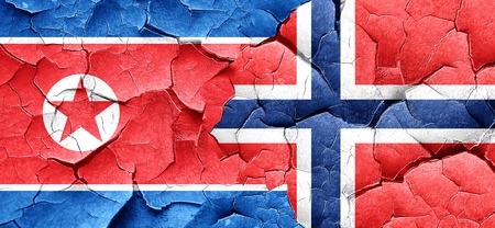North Korea flag with Norway flag on a grunge cracked wallの写真素材