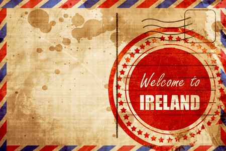 Welcome to ireland card with some soft highlights, red grunge stamp on an airmail backgroundの写真素材