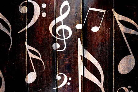 Vintage Music notes on a grunge wooden panelの写真素材