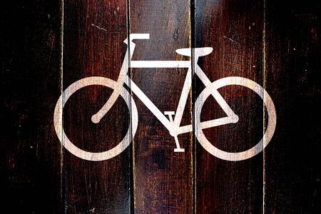 Vintage bike sign on a grunge wooden panelの写真素材