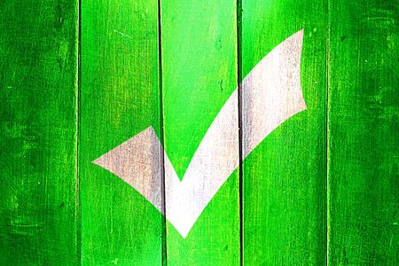 Vintage Approved tick on a grunge wooden panelの写真素材