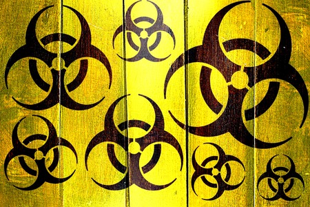 Vintage Biohazard sign on a grunge wooden panelの写真素材