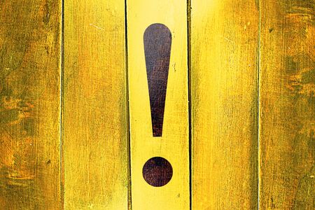 Vintage Hazard warning sign on a grunge wooden panelの写真素材