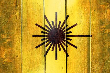 Vintage Laser warning symbol on a grunge wooden panelの写真素材