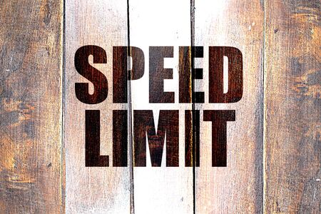 Vintage speed limit on a grunge wooden panel