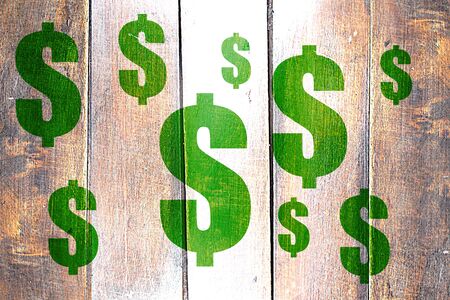 Vintage dollar sign on a grunge wooden panelの写真素材