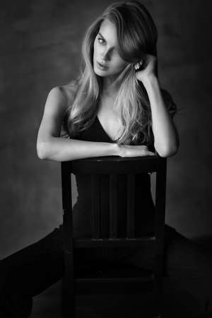 Beautiful woman in black dressの写真素材