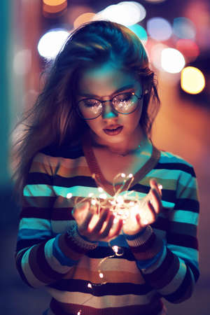Beautiful young female model outside