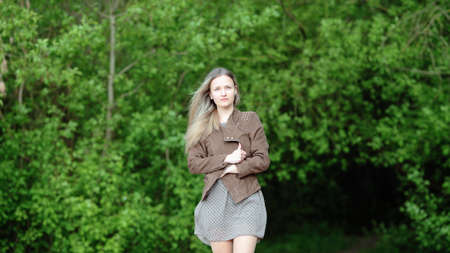 Young girl goes out of the forestの写真素材