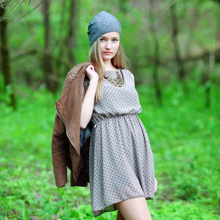 Closeup portrait of romantic fashion young woman smile in the woods の写真素材