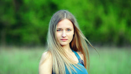 Outdoor closeup portrait of romantic fashion young womanの写真素材