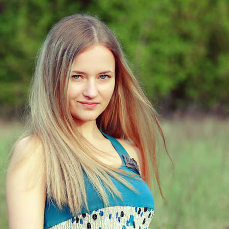 Outdoor closeup portrait of romantic fashion young womanの写真素材