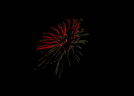 Beautiful colorful holiday fireworks on the black sky backgroundの写真素材