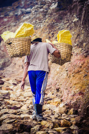 worker for sulfur mining industry in KAWAH IJEN VOLCANO, EAST JAVA, INDONESIA のeditorial素材
