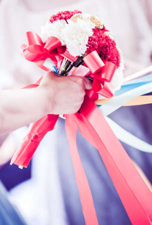 Beautiful bouquet in the hands of a brideの写真素材