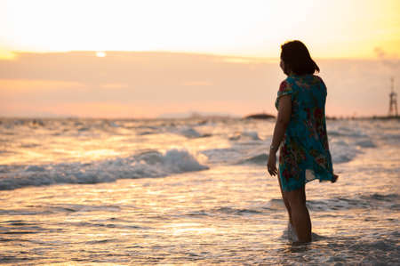 lonely women on the beachのeditorial素材