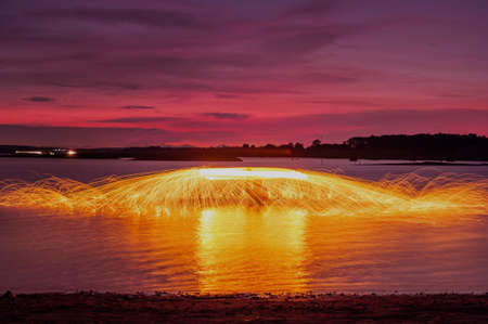 Paint lighting : Circle Painted by fire in twilight(light painting)