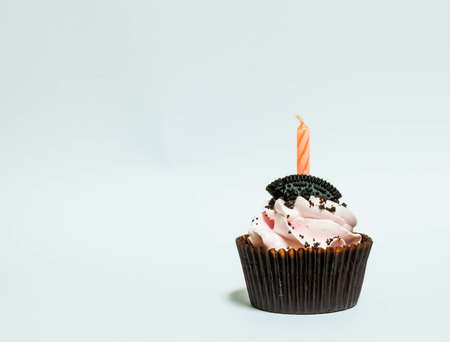 tasty birthday cupcake with candleの写真素材