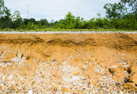 Beneath the asphalt. Layer of soil beneath the asphalt road.の写真素材