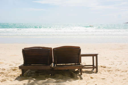 Two sitting place in a tropical beachの写真素材