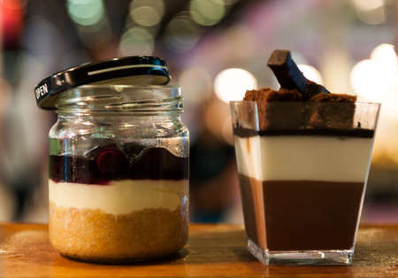 Layered freshly chocolates cake baked in a glass for serving as an individual dessert