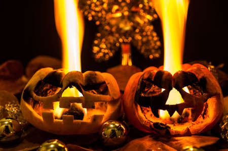 Halloween - old jack-o-lantern on black backgroundの写真素材