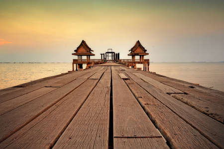 Twilight wood bridge at Djittabhawan Temple tourist attraction in Pattaya,Thailandの写真素材