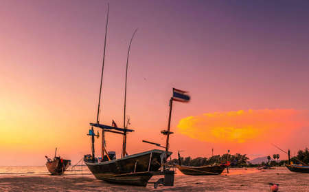 fishing boat at sunsetの写真素材