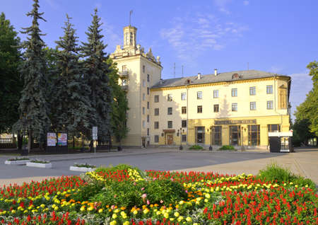 The square near the Gorky House of Culture. A monument of architecture of Soviet classicism, a flower lawn in front of a residential building with a tower. Novosibirsk, Siberia, Russiaの写真素材