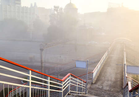 Descent to the pedestrian bridge over the railway tracks of the Trans-Siberian railway. Siberia, Russiaの写真素材