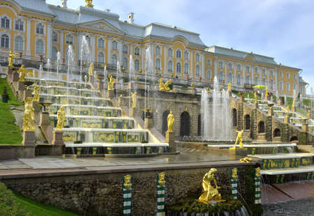 Peterhof / Russia-09.01.2020: terrace of the Grand Palace. Bottom view of the Russian Baroque monument of the XVIII century, included in the UNESCO world heritage list. Golden sculptures of ancient heroes among water jetsのeditorial素材