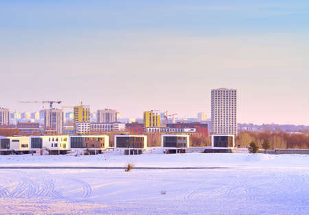 Winter morning on the Ob. New residential area on the frozen river bank in Novosibirsk. Siberia, Russia, 2021の写真素材