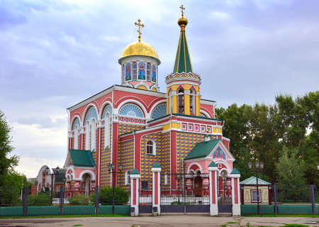 Colorful Orthodox church under a blue cloudy sky. Abakan, Khakassia, Siberia, Russiaの写真素材