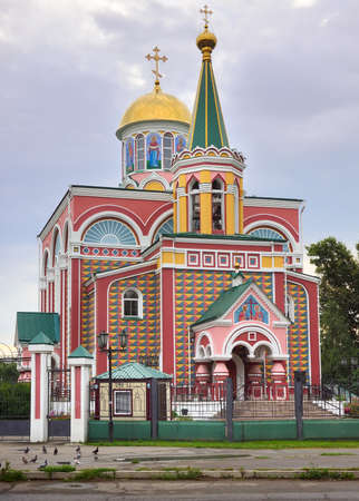 Bright architecturally decorated facade in Russian traditional style under a cloudy sky. Abakan, Siberia, Russiaの写真素材