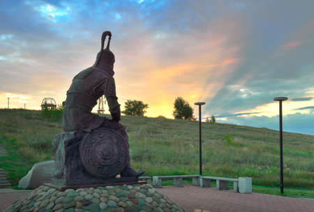 Abakan, Siberia, Russia-09.01.2021: Sculpture of a steppe warrior against the background of the rays of the rising sunのeditorial素材