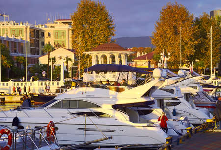 Sochi, Russia - 11.01.2021: Motor yachts at the sea station. The embankment of the city in the...
