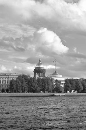Saint Petersburg / Russia-09.03.2020: English embankment of the Neva river. Dome of St. Isaac's Cathedral over the roofs of palaces, architecture of the XIX centuryのeditorial素材