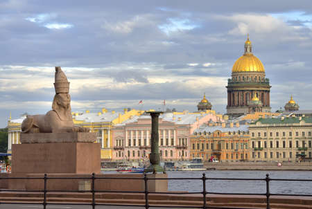 Saint Petersburg / Russia-09.03.2020: Sphinx on the Bank of the Neva river. Egyptian monument on the University embankment, the dome of St. Isaac's Cathedral, XIX centuryのeditorial素材