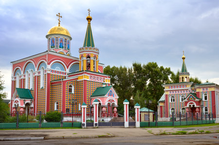 Bright architecturally decorated facade in Russian traditional style under a cloudy sky. Abakan, Siberia, Russiaの写真素材
