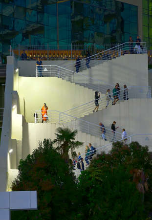 Sochi, Russia, 11.01.2021. Staircase descent to the Lighthouse embankment in night illumination, vacationers on the stepsのeditorial素材