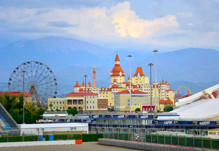 Adler, Sochi, Russia, 11.01.2021. Sochi Amusement Park. Stylized children's castle with domes on the background of mountains under a cloudy skyのeditorial素材