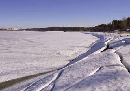 Melting ice on the shore of the Berdsky Bay. Novosibirsk, Siberia, Russiaの写真素材