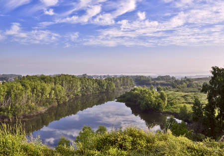 Grass over the Tula riverbed under a cloudy sky. Novosibirsk Region, Siberia, Russiaの写真素材